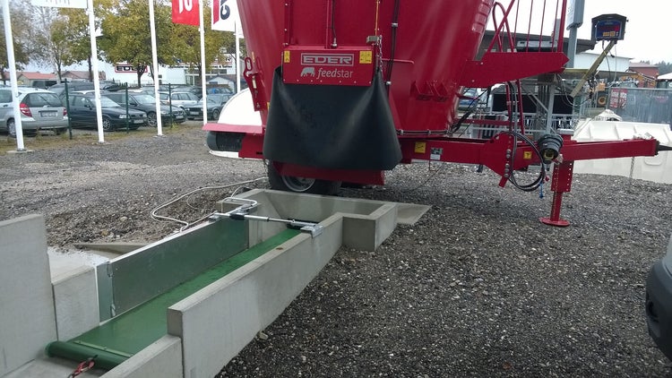picture of a red feed mixer w